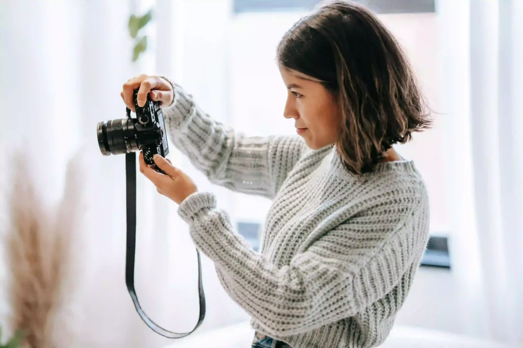 Professional photographer taking pictures with a camera